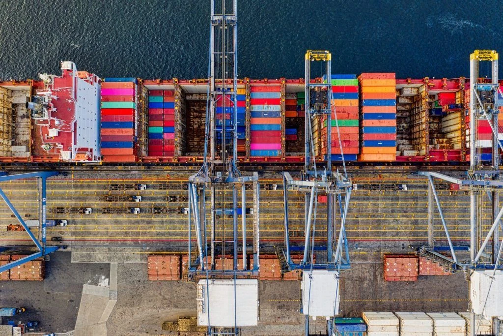 Image of cargo being loaded off a ship